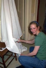 Lee steaming the dress without damaging herself or it